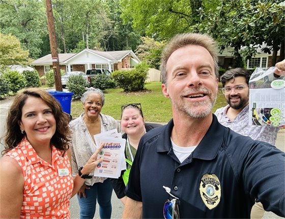 Carrboro Staff handing out bags of information to Carrboro residents