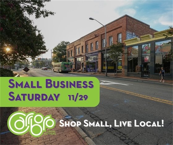 shop small live local with a photo of Carrboro Main Street