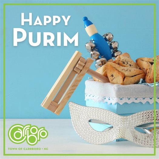light blue background with basket full of symbolic Purim items with Happy Purim written beside it