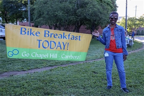 Mayor Foushee stands by Bike Breakfast sign on the Libba Cotten Bikeway