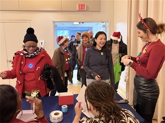 employees checking into the Employee Holiday Luncheon
