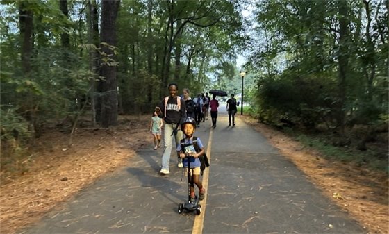 community biking to school at the N. Greensboro St roundabout