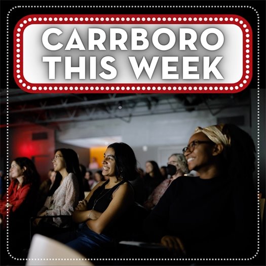 People in the ArtsCenter watching a film at the Film Fest with Carrboro This Week surrounded by marquee lights