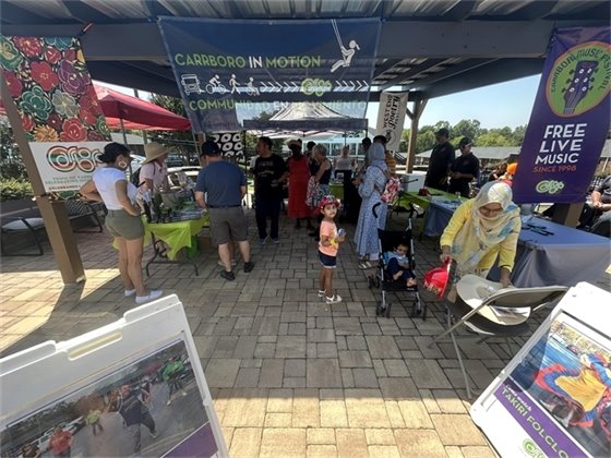 Neighbors gather at Carrboro in Motion for information on Town resources