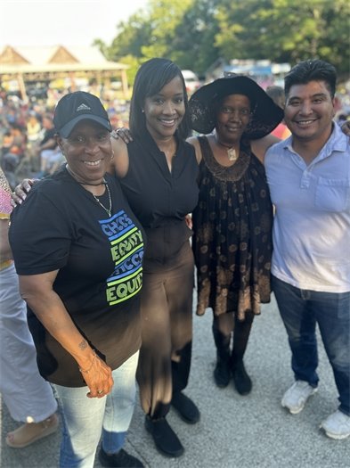 Carrboro Community claps along with music from a Freight Train Blues Concert at Carrboro Town Commons