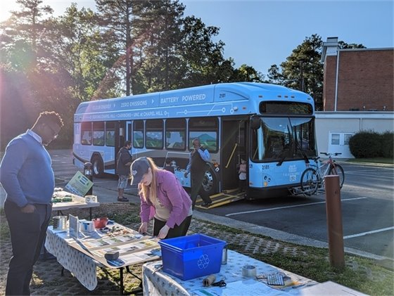 Carrboro Town Staff prepare materials for visitors to the Carrboro Earth Day Event