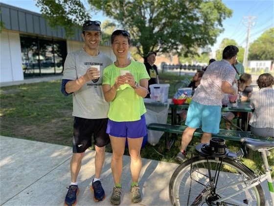 A couple pose for a smile after blending the smoothies with a bike blender