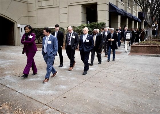 Mayors walking across courtyard at Metro Mayors Event