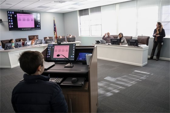 Town staff hosting third graders in the council chambers for a mock council meeting