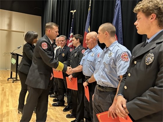 Chief Will Potter shakes hands