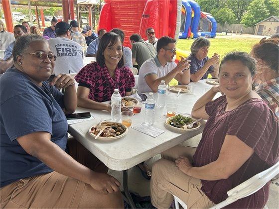 New Town Manager, Patrice Toney eats with Town staff at the Employee Picnic