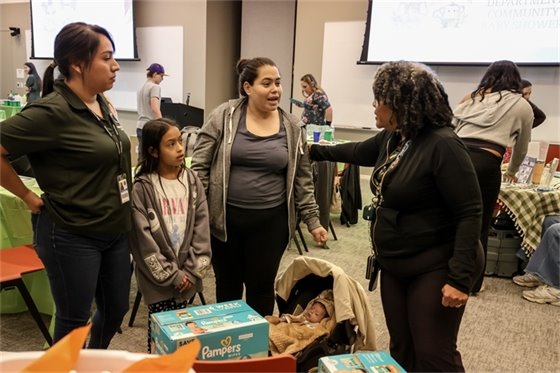 family receives gift at PD baby shower