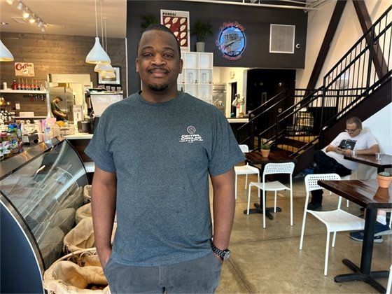 Owner of The Flying Pierogi, Jaysen Wilson, stands inside his newly opened deli.