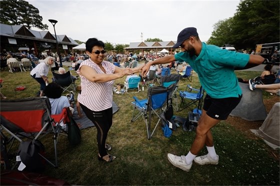 Community dances on Carrboro Town Commons during a Freight Train Blues Concert