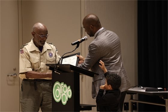 Allen Buansi presenting Braxton Foushee with Order of the Long Leaf Pine