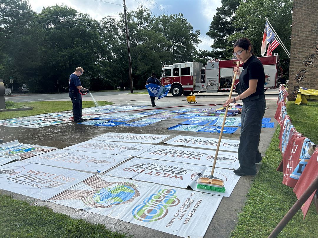 cleaning banners after Tropical Storm Chantal